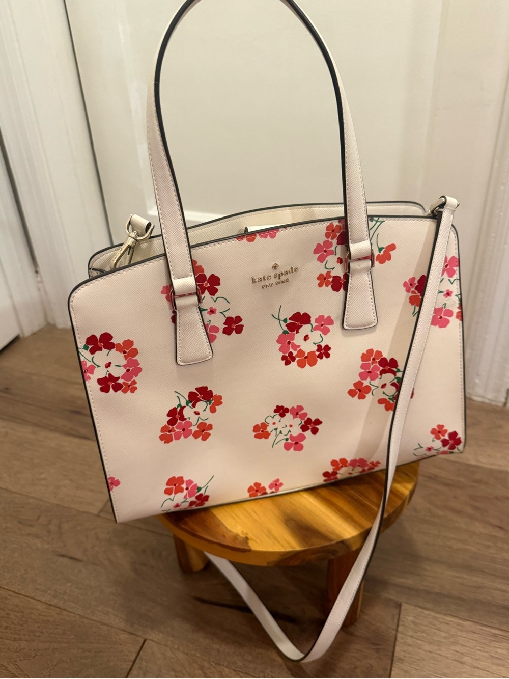kate spade cream floral satchel with red and pink blooms